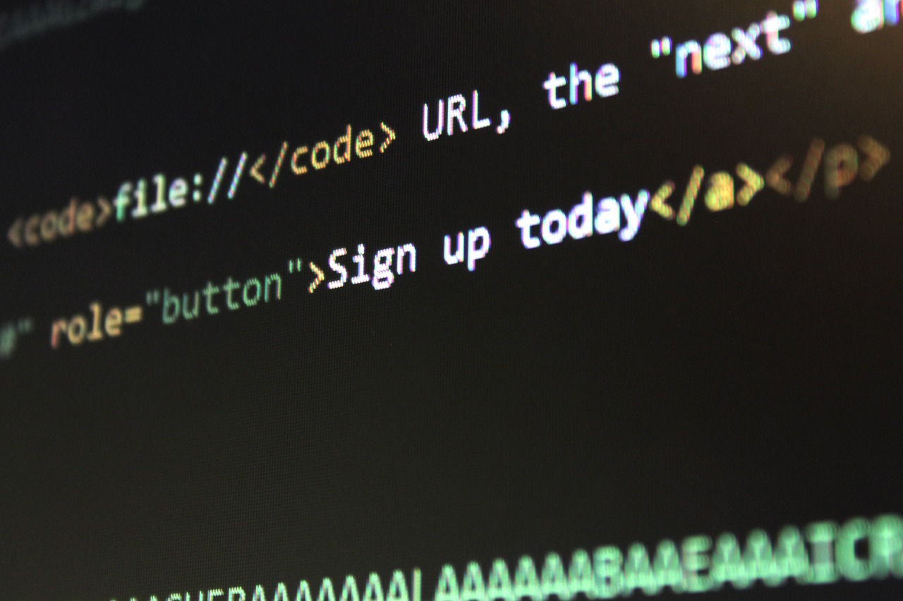 Website code displayed on a monitor